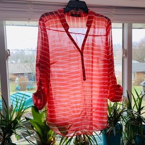Salmon colored striped see through blouse